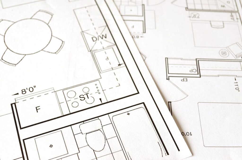 pexels-photo-271667 Close-up view of an architectural floor plan on paper showcasing detailed room layouts and measurements.